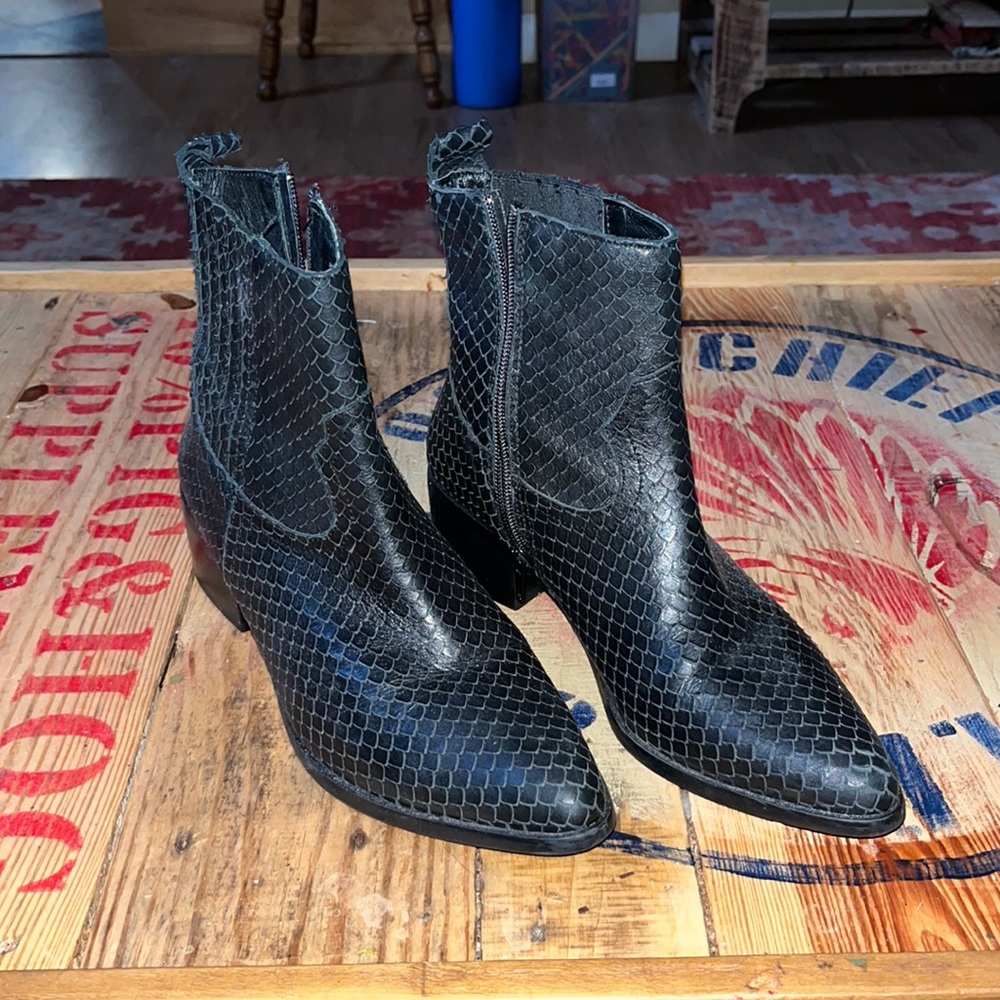 Excellent pair of Steven Madden booties.  All leather.  Ostrich looking texture.